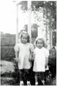Celesta and Jackie by the front door of the home at Elmington. The greenery in the upper right corner is Morning Glories.
