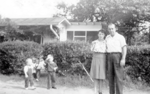 Lulie's Family with the Keleda home in the background
